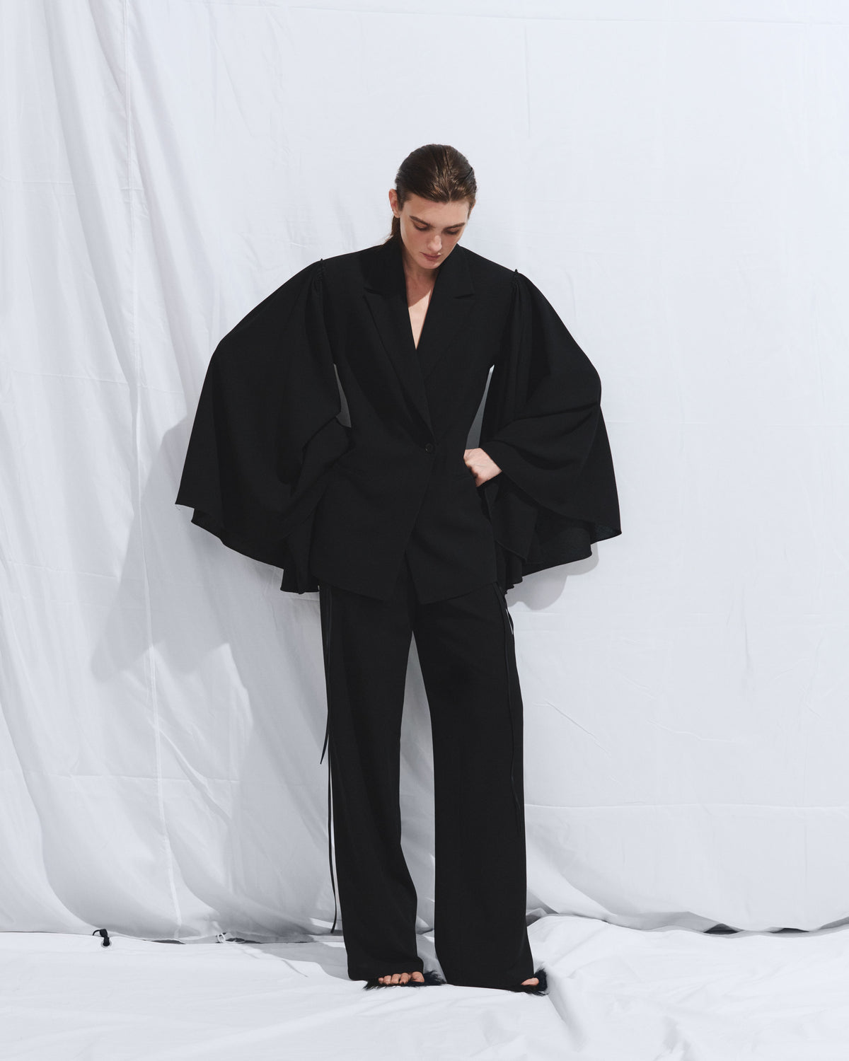 Black fitted poncho jacket