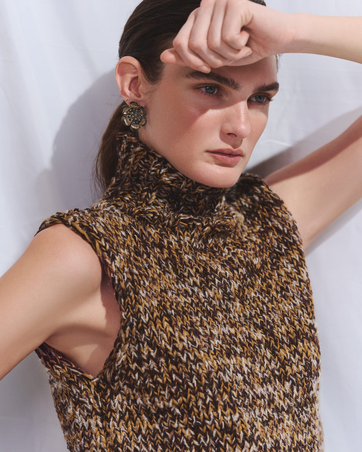 Knitted hand made vest with a high neck