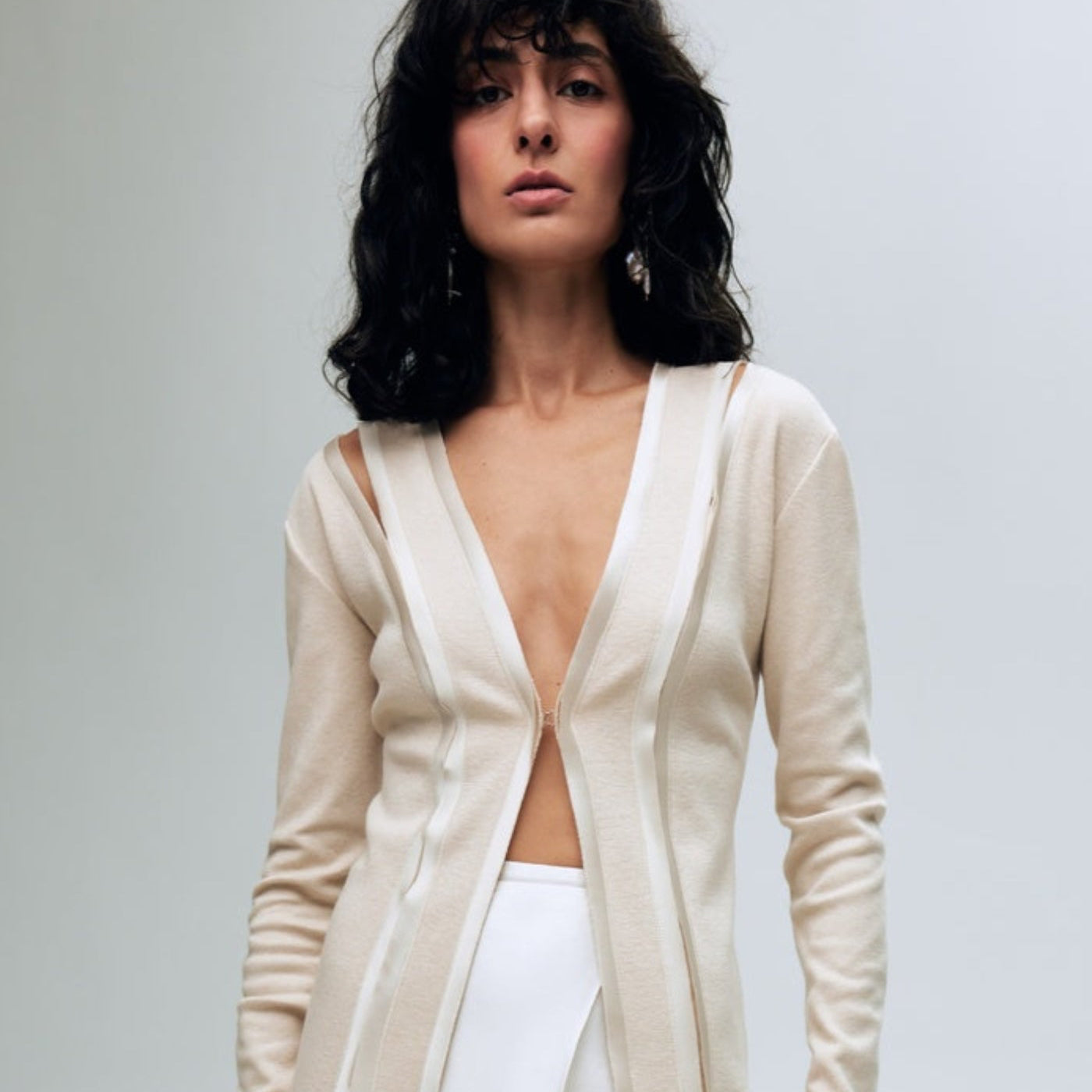 Beige cardigan with slits and silk finishing