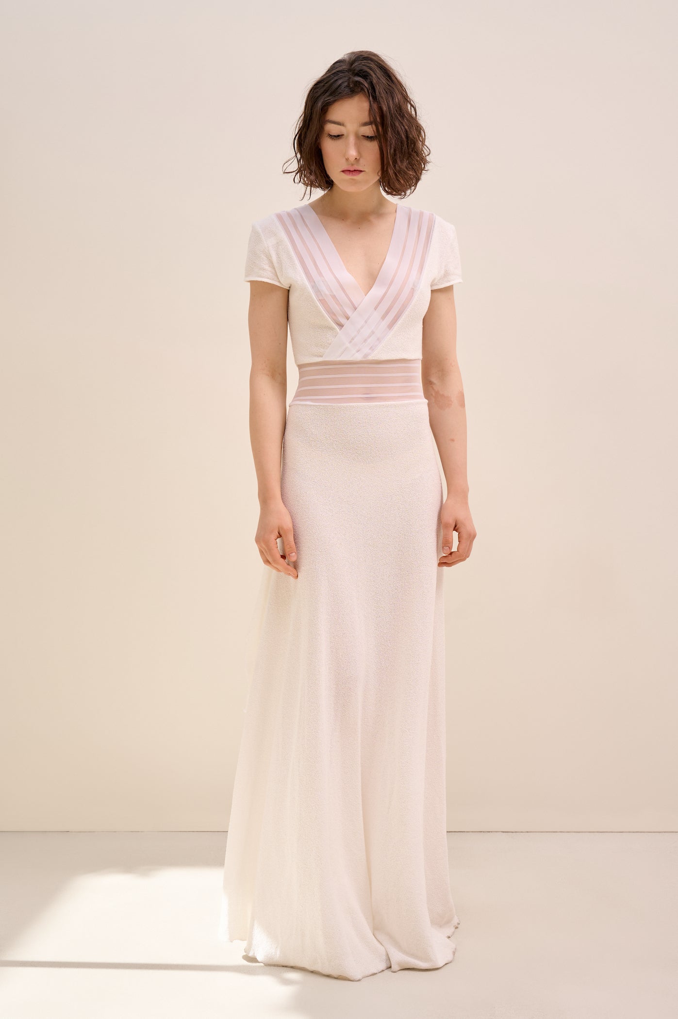 Knitted white dress with sheer ribbons