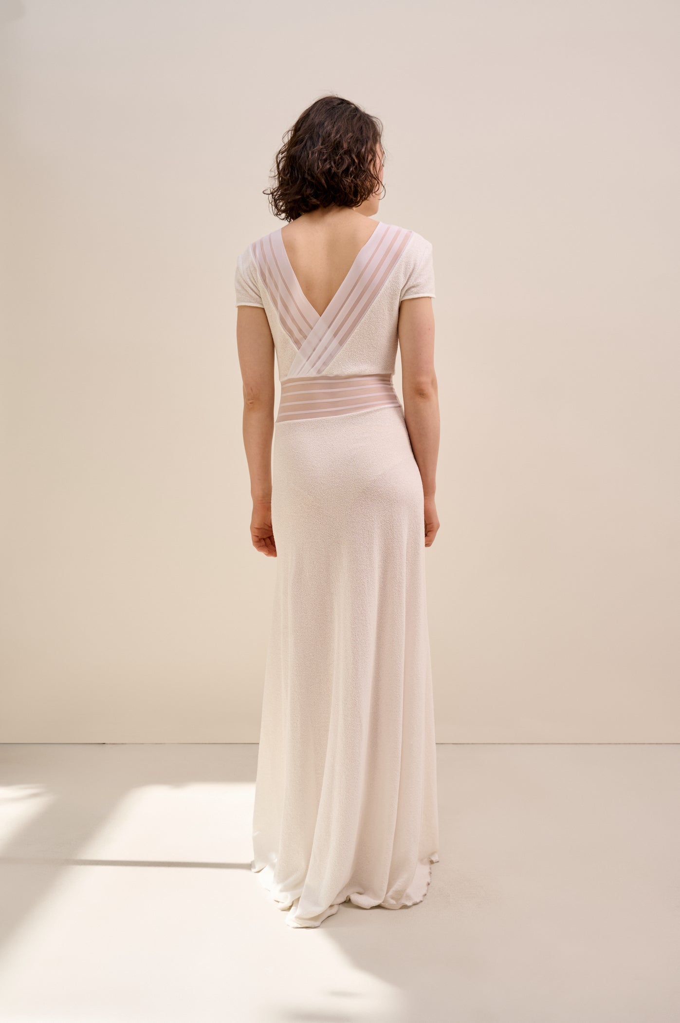 Knitted white dress with sheer ribbons