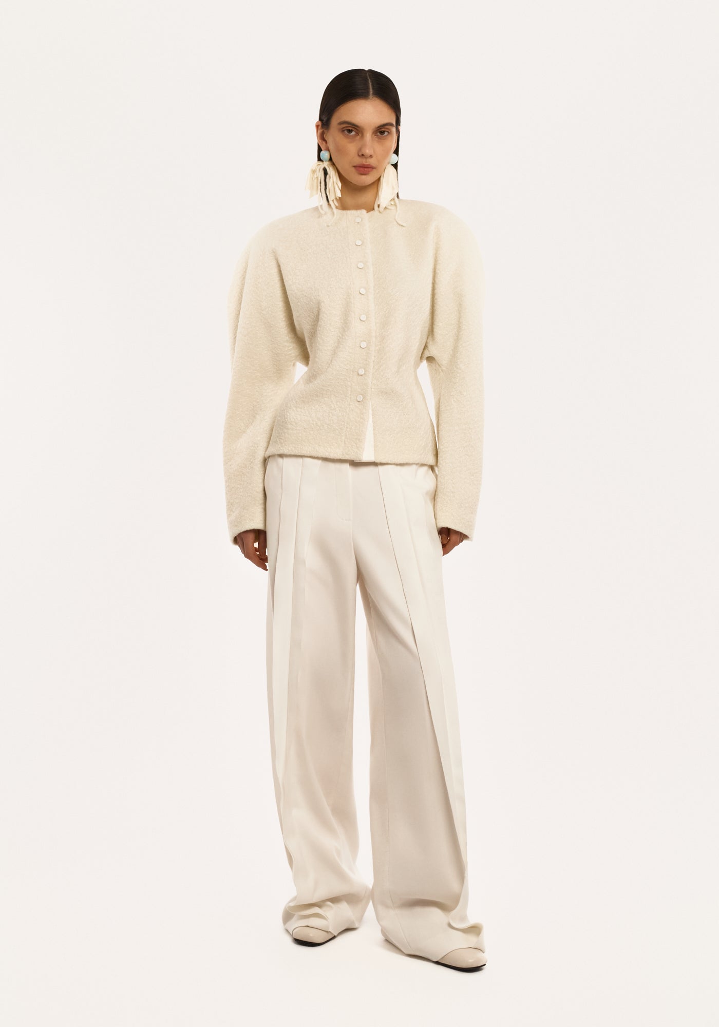 White trousers with raw seams