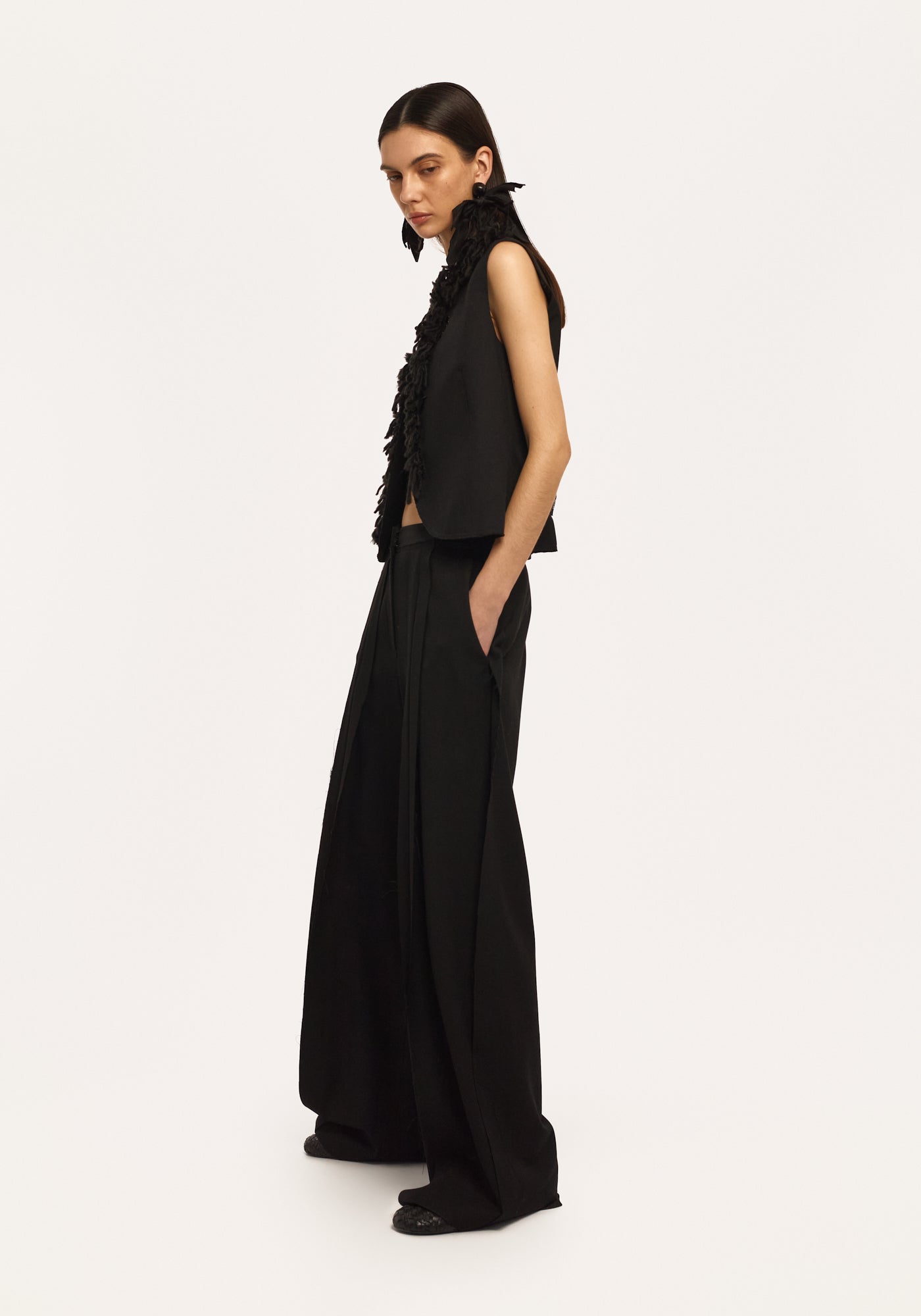 Black trousers with raw seams