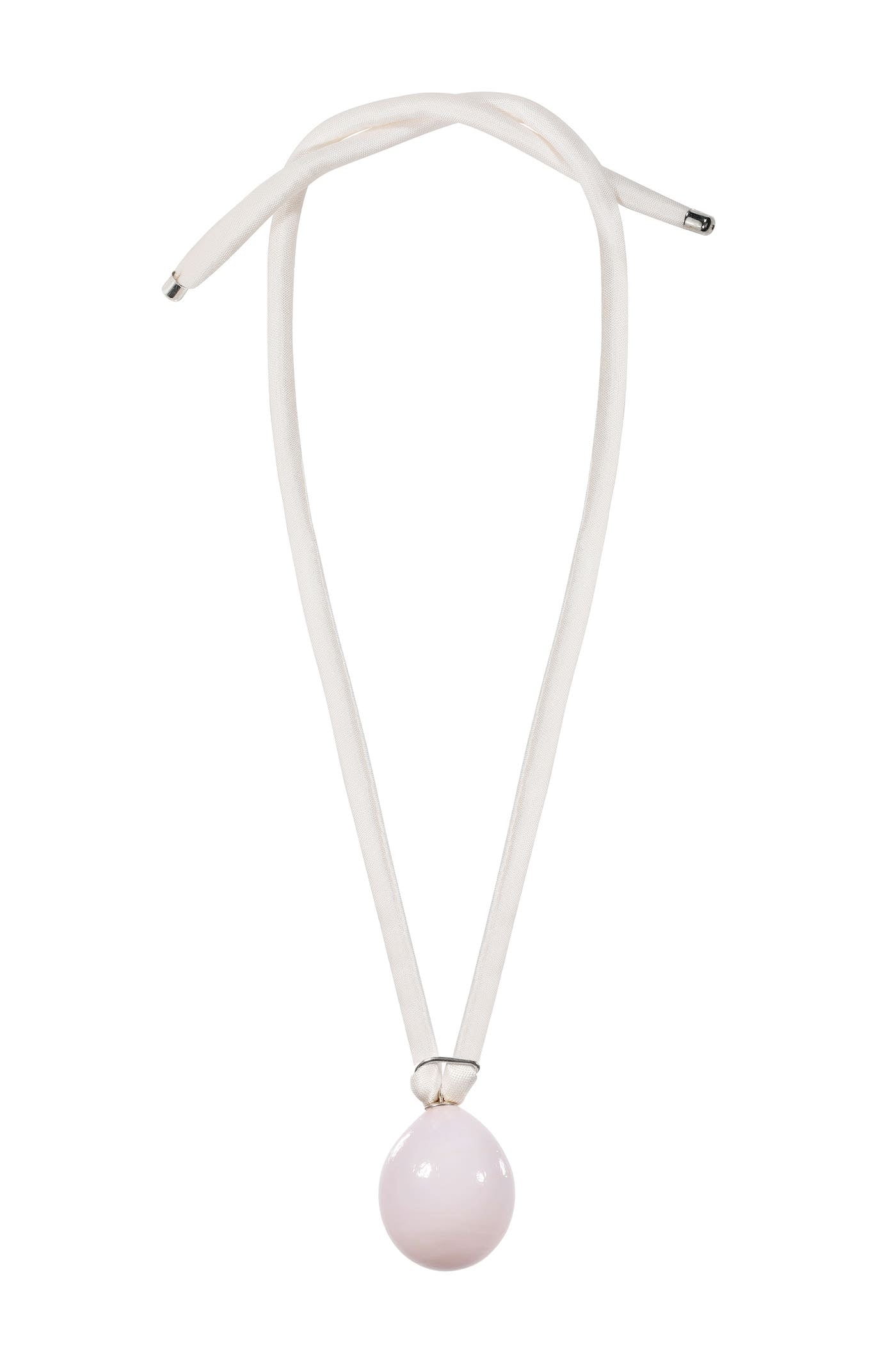 Pendant on the silk ribbon