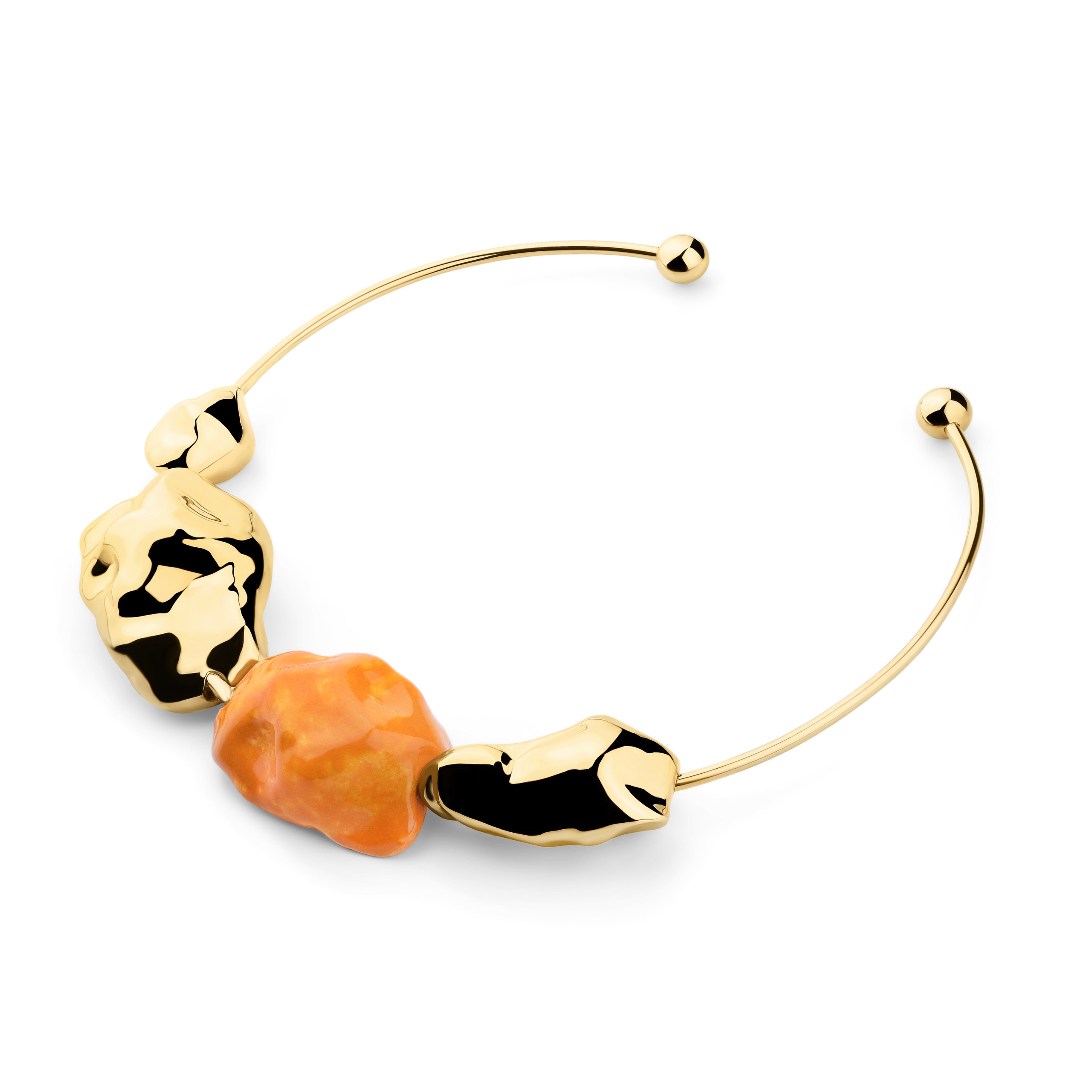 Golden necklace with orange bead